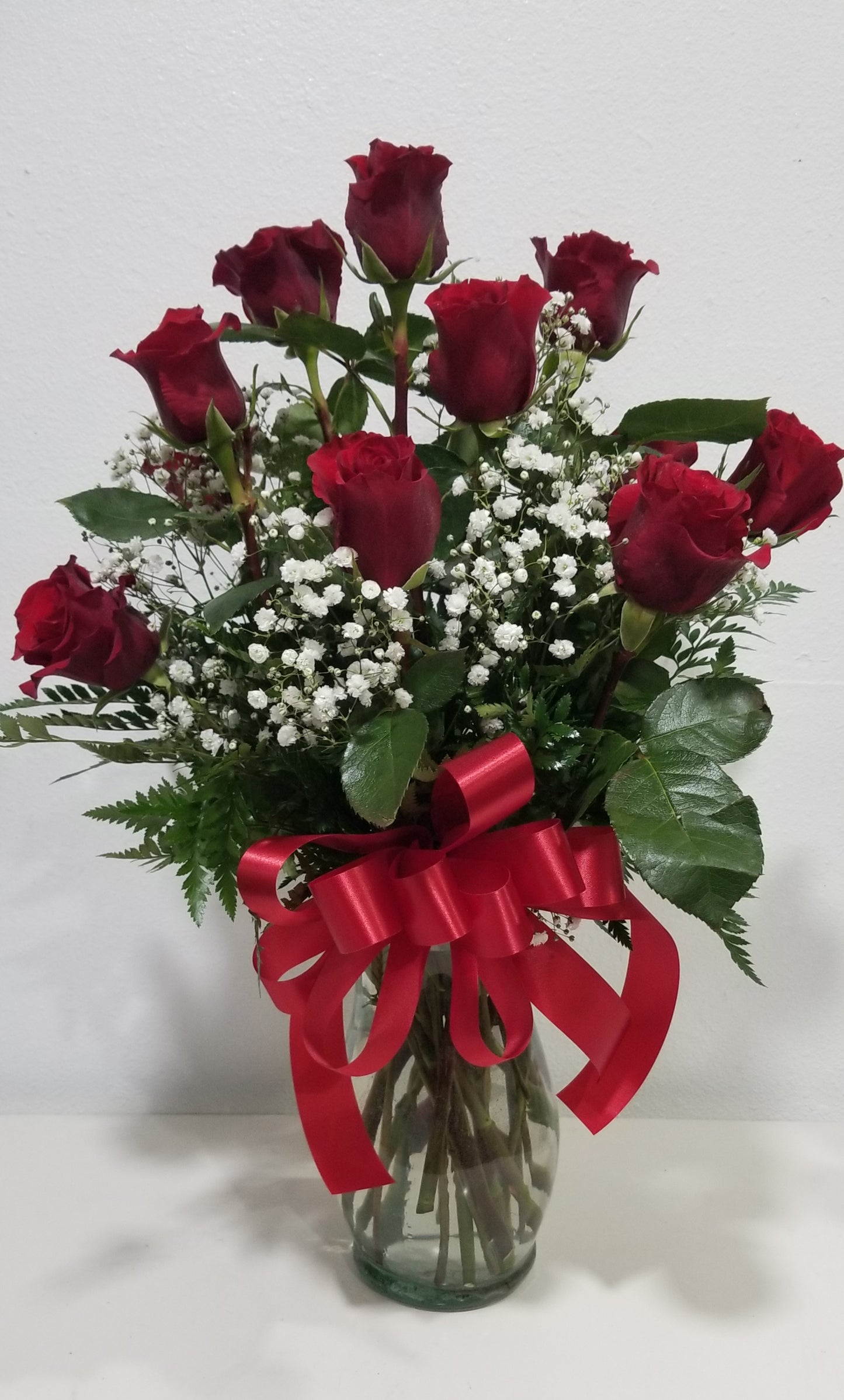 Traditional dozen of roses in vase