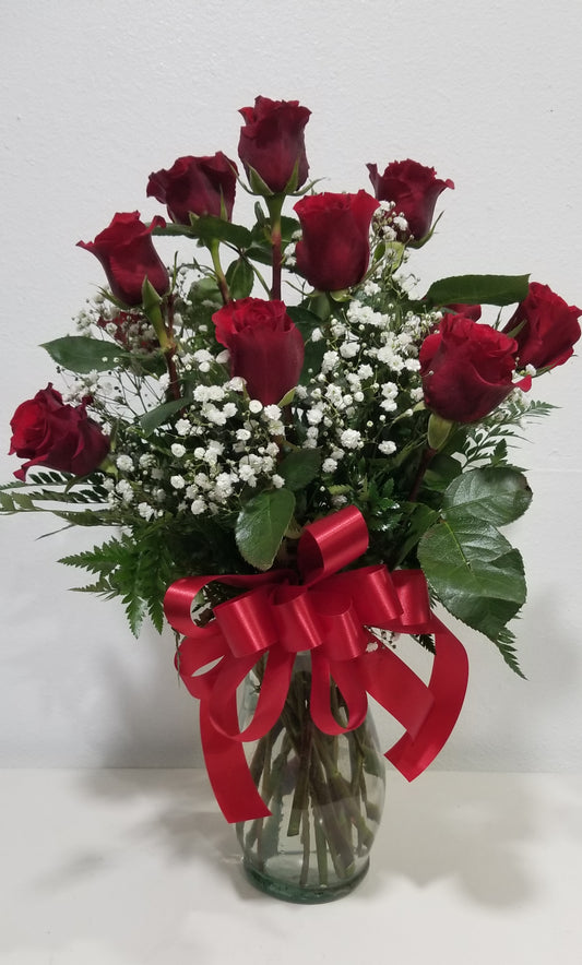 Traditional dozen of roses in vase